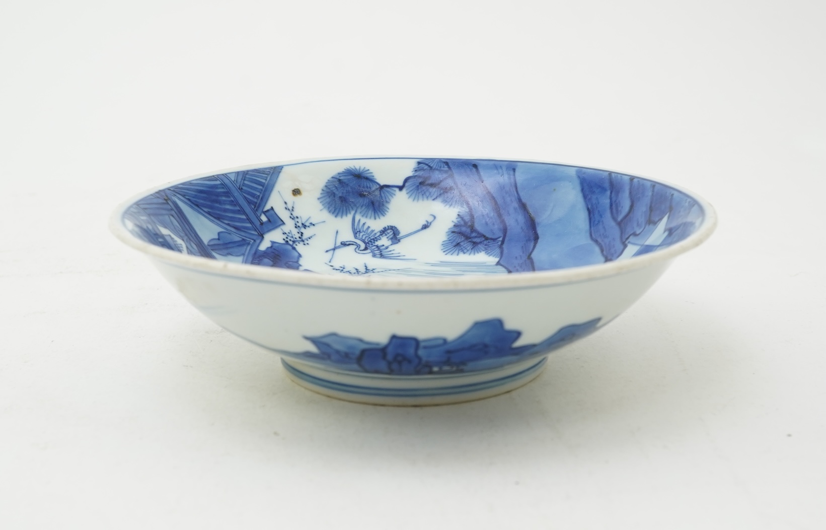 A Chinese blue and white saucer dish, Kangxi six character mark and of the period (1662-1722)